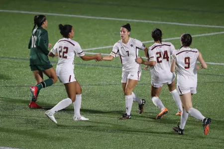 The Eagles celebrate Gaby Carreiro's PK goal.