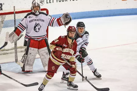 Kate Annese fights for possession against Northeastern.