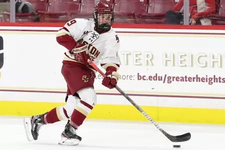 Hannah Bilka carries the puck up the ice.