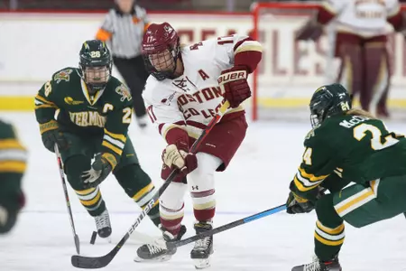 Delaney Belinskas carries the puck up the ice against Vermont.
