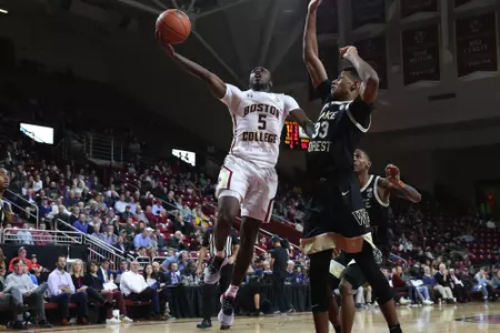 Jay Heath scores over a Wake Forest defender
