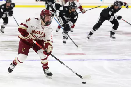 Jillian Fey rushes the puck up the ice against Providence.