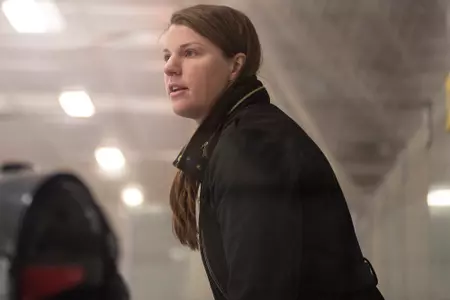 Taylor Wasylk behind the bench.