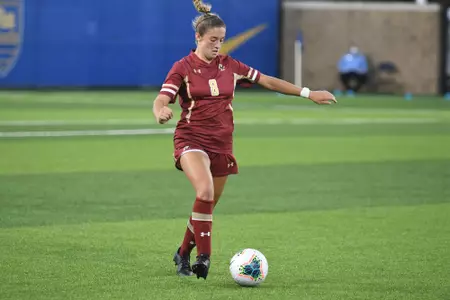 Laura Gouvin dribbles the ball up the field.