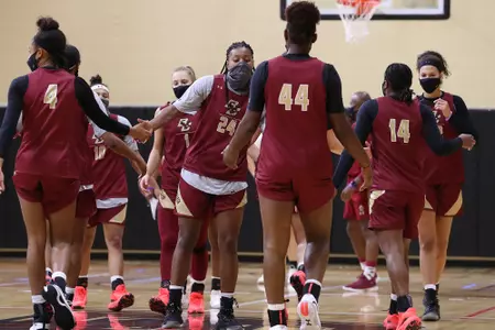 Taylor Soule gives her teammates encouragement after a drill during practice.