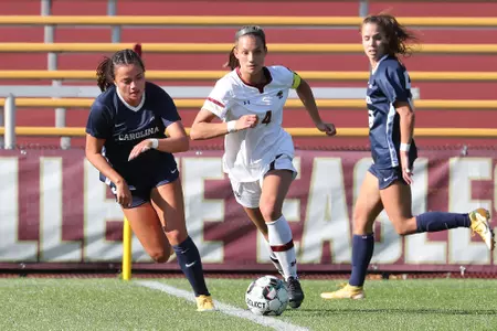 Jenna Bike carries the ball across the field against UNC.