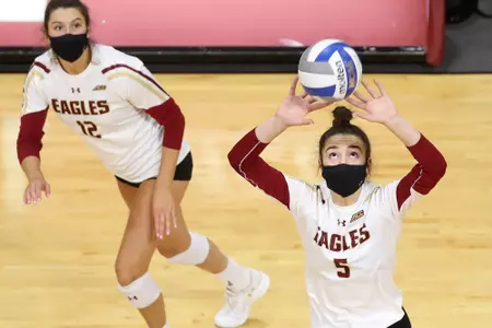 Sophia Lambros sets the ball vs. Louisville