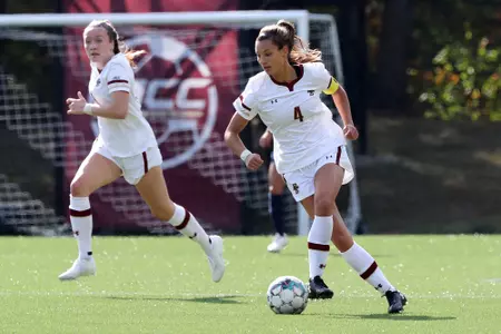 Jenna Bike moves the ball up the field against UNC.
