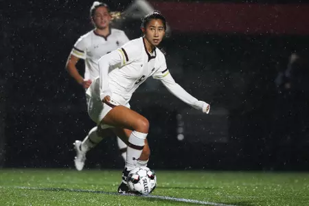 Sonia Walk looks to go up the field against UVA.