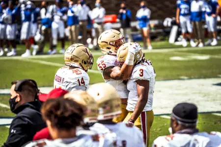 The BC defense celebrates a stop at Duke