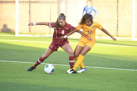 Jenna Bike battles for a ball against Pitt.