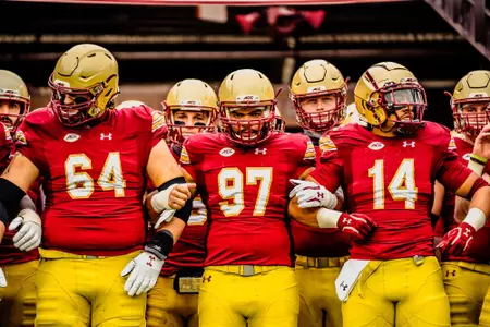 Ben Petrula, Marcus Valdez and Max Richardson lead the team to the field prior to kickoff vs. Georgia Tech