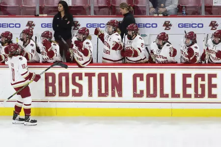 Caroline DiFiore celebrates a goal by skating past the bench.