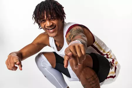 Makai Ashton-Langford is pointing at the camera and smiling