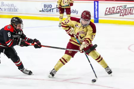 Jillian Fey battles for the puck against Northeastern.