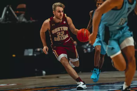 Rich Kelly drives the lane vs. Rhode Island