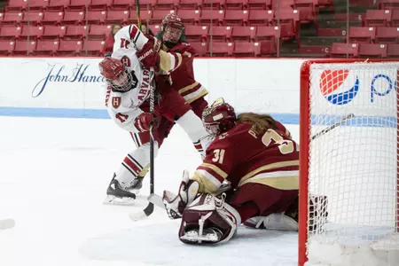 Kelly Pickreign makes a glove save against Harvard.