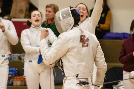 A BC fencer celebrates a victory at the Beanpot.