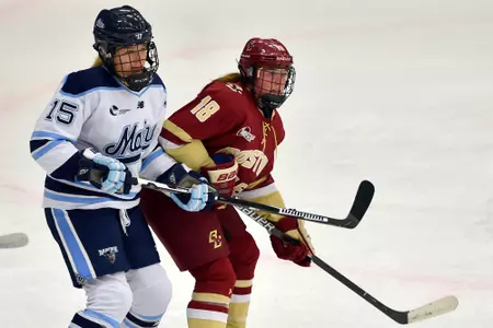 Kelly Browne fights for position against Maine.