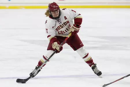 Delaney Belinskas carries the puck up the ice and looks to shoot.