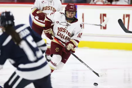 Olivia Finocchiaro looks to break the puck out against UNH.