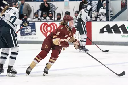 Savannah Norcross looks to go up the ice against UNH.