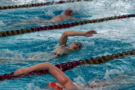 Women's swimmers in the pool against Boston University