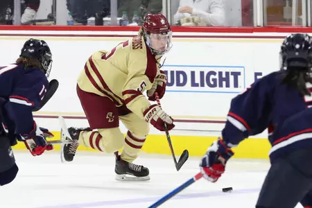 Savannah Norcross battles for the puck against UConn.