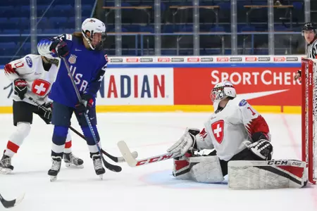 Alex Carpenter deflects the puck in a game at the World Championships.