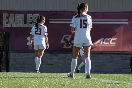 Micheal Agresti (left) and Samantha Agresti (right) walk across the field.