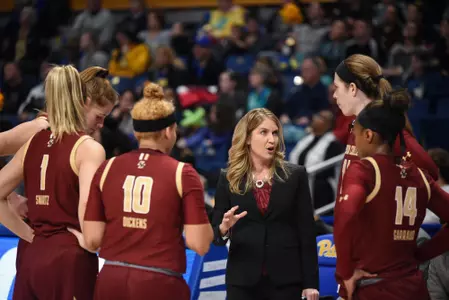 Coach Joanna Bernabei-McNamee gathers the team for a huddle during a timeout  vs. UMass Lowell on Nov. 5, 2019