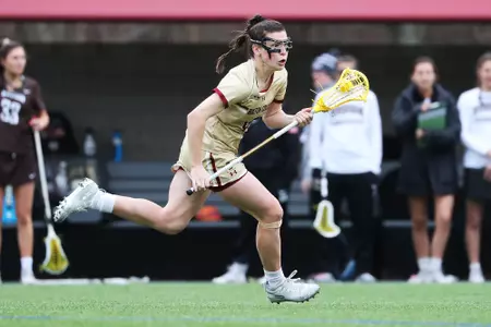 Charlotte North runs downfield against Brown
