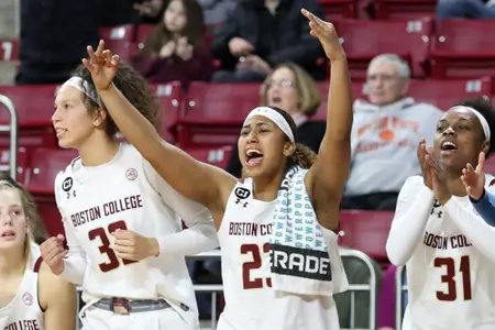 Milan Bolden Morris, Clara Ford and Sydney Lowery cheer on their teammates vs. Pitt, Jan. 5, 2020