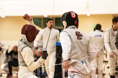 A BC fencer competes at the Beanpot.