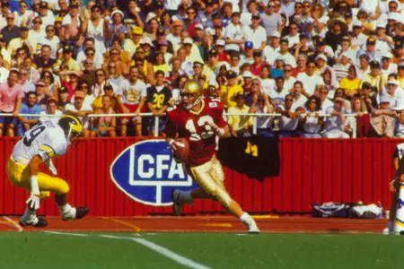 Glenn Foley rolls left vs. Michigan in 1991