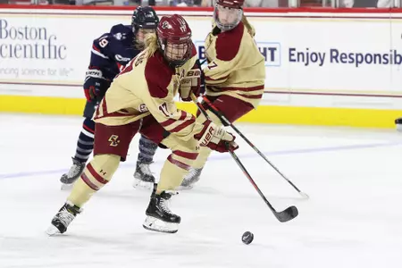 Delaney Belinskas carries the puck into the zone against UConn.