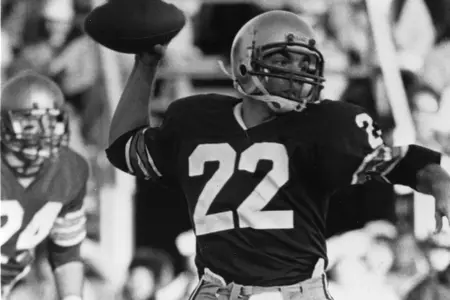 Doug Flutie looks right to pass.