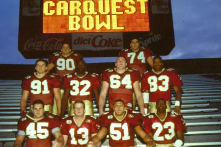 BC players pose in front of the Alumni Stadium scoreboard prior to the 1994 Carquest Bowl.