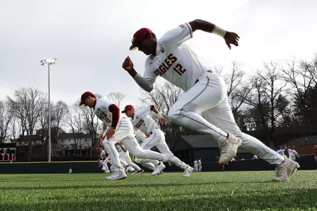 BC baseball players participate in warmups prior to their Holy Cross game in March 2020.