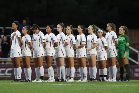 The BC women's soccer team lines up before a game.