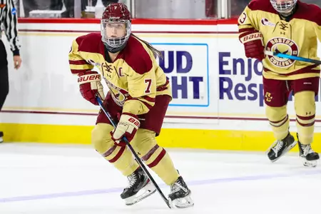 Maegan Beres looks to move up the ice while Jillian Fey is in the background.