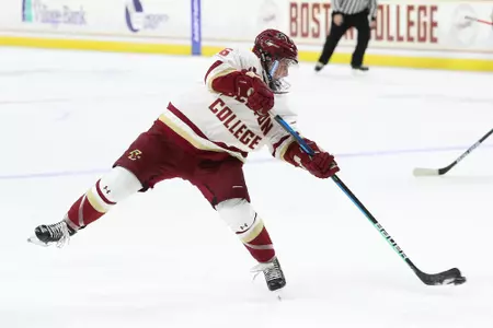 Alexie Guay shoots the puck on net from the face-off circle.