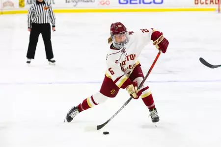 Sidney Fess takes a slap shot from the point against Holy Cross.