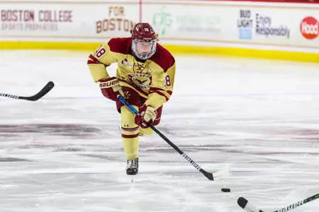 Kelly Browne skates the puck up the ice against Northeastern.