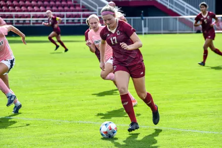 Abby McNamara battles for the ball at Louisville.