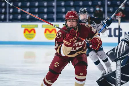 Abby Newhook skates to the puck against Penn State.