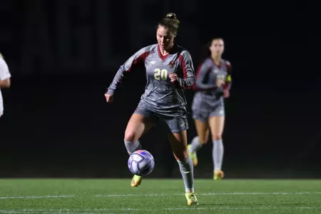 Alison Heckman takes the ball up the field against Virginia.