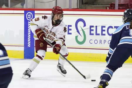 Hannah Bilka carries the puck in the zone against Maine.