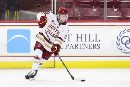 Jillian Fey carries the puck up the ice.