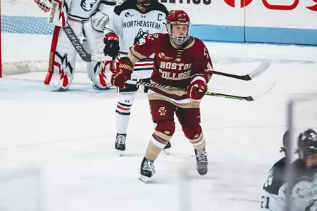Jillian Fey battles in front of the net against Northeastern.